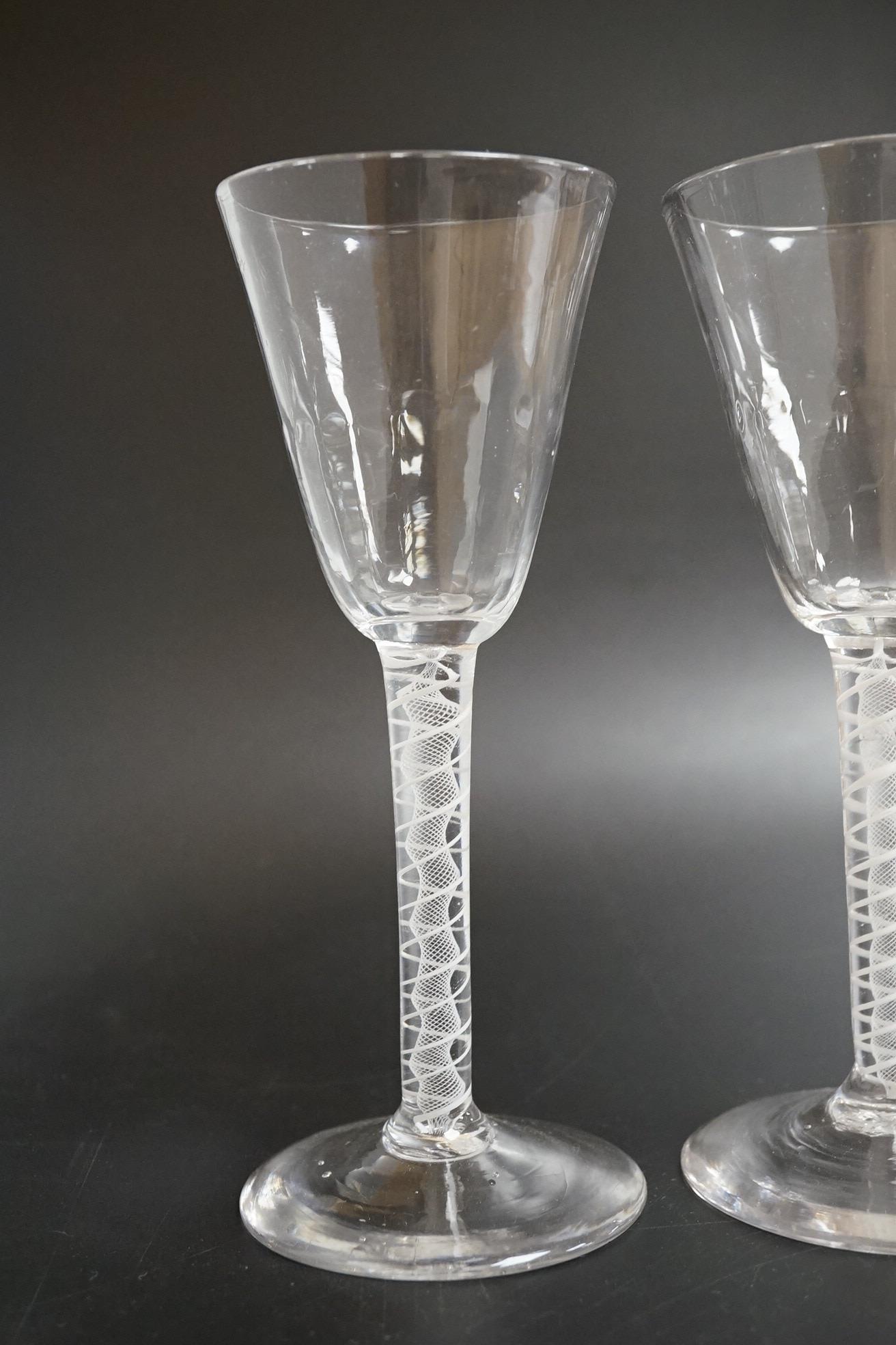 A near pair of opaque twist wine glasses, c.1760, 17.3cm high